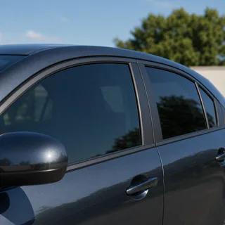 Privacy tint on a blue-gray everyday vehicle