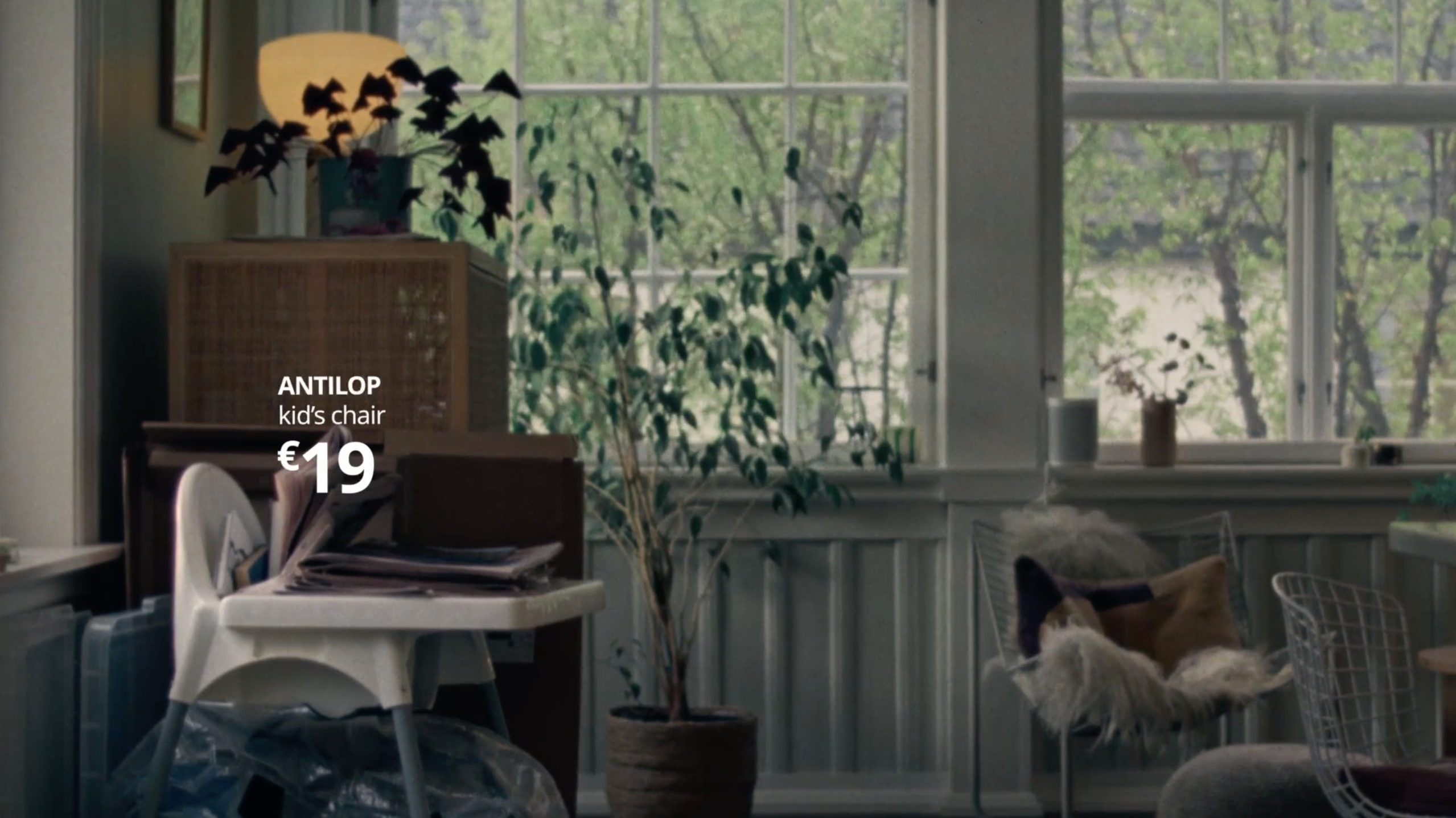 ANTILOP kid's chair for €19 in a bright, plant-filled room.