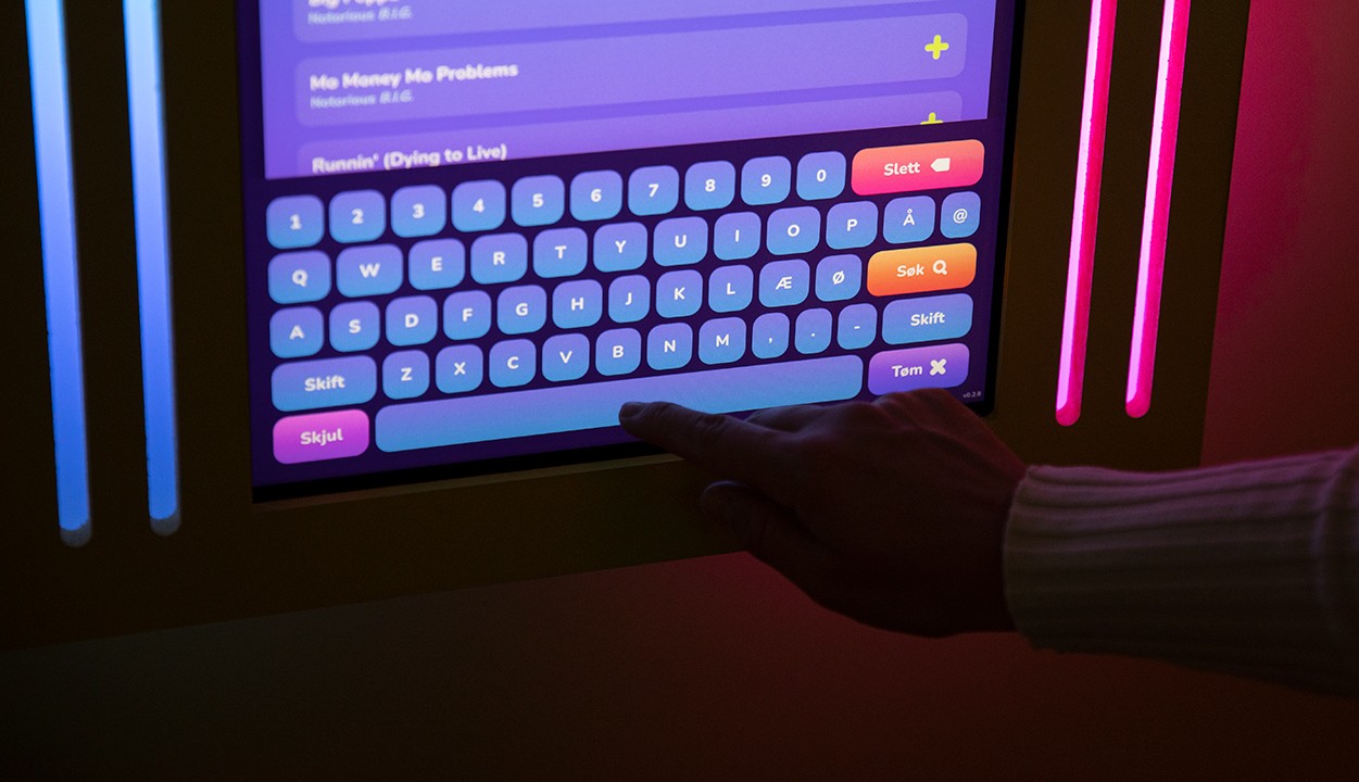 Photograph of a SYNG karaoke room