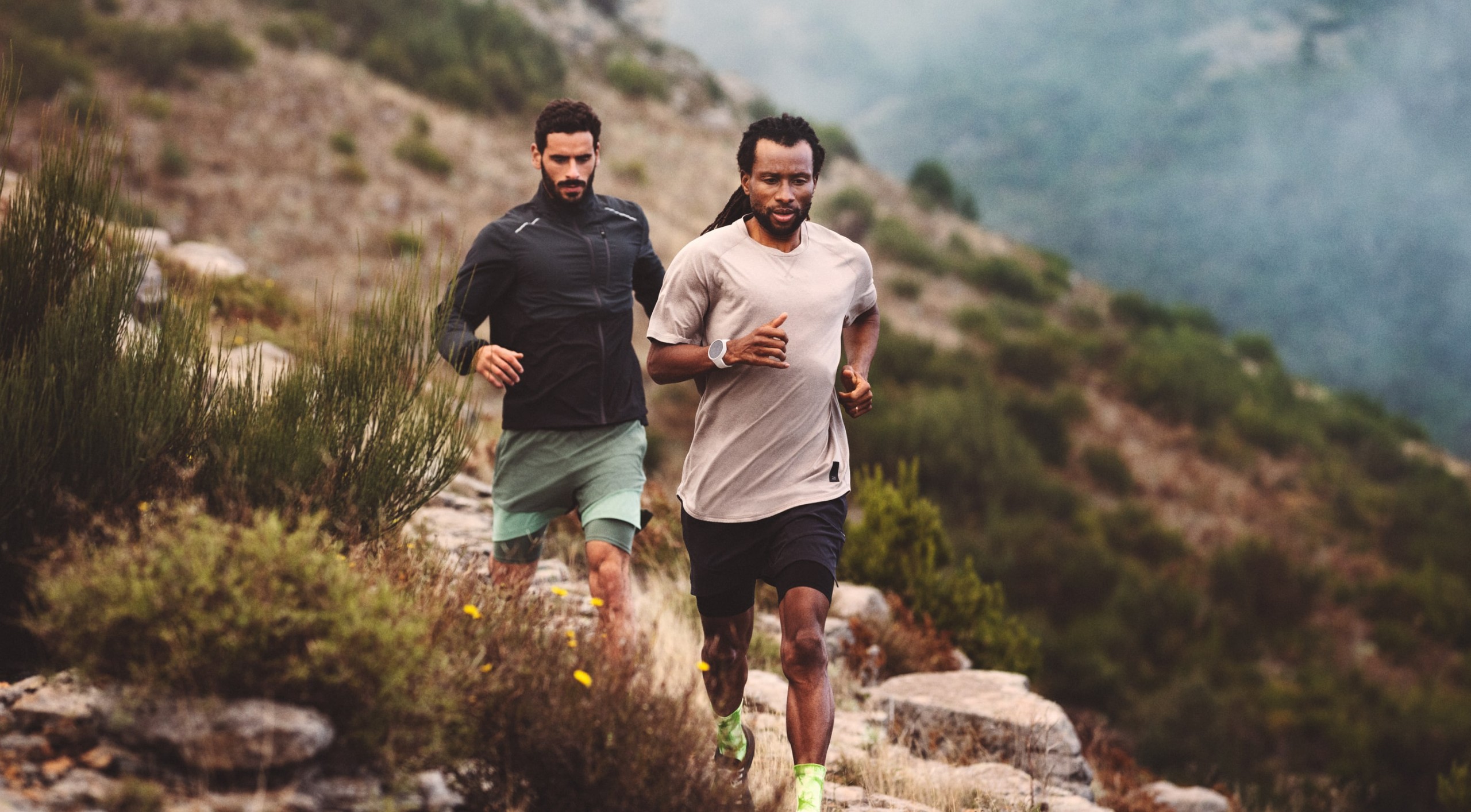 Wide image from H&M Sport's Head into space visual concept for its trailwear collection, set in a vast natural landscape