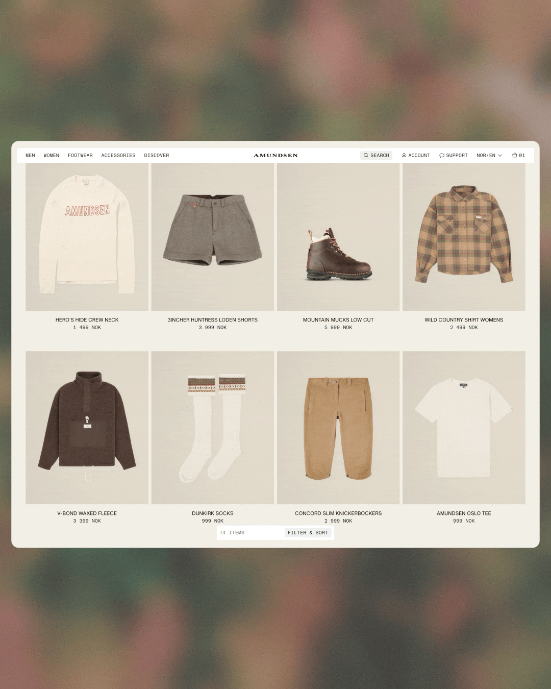 Amundsen e-commerce product page displaying a grid of outdoor clothing and footwear.