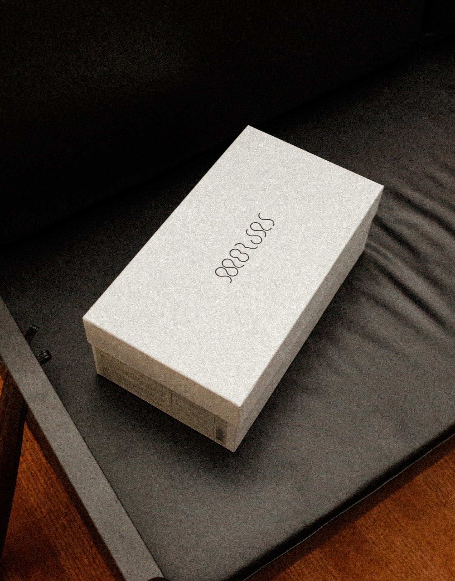 Morjas brand identity detail: packaging or graphic application, portrait format