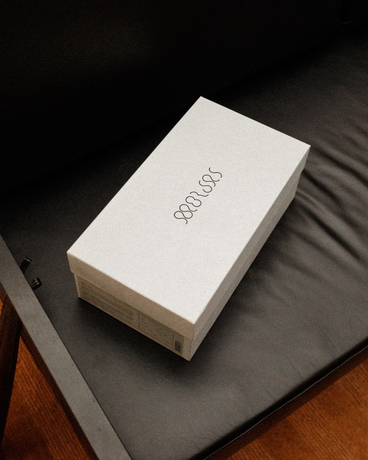 Morjas brand identity detail: packaging or graphic application, portrait format
