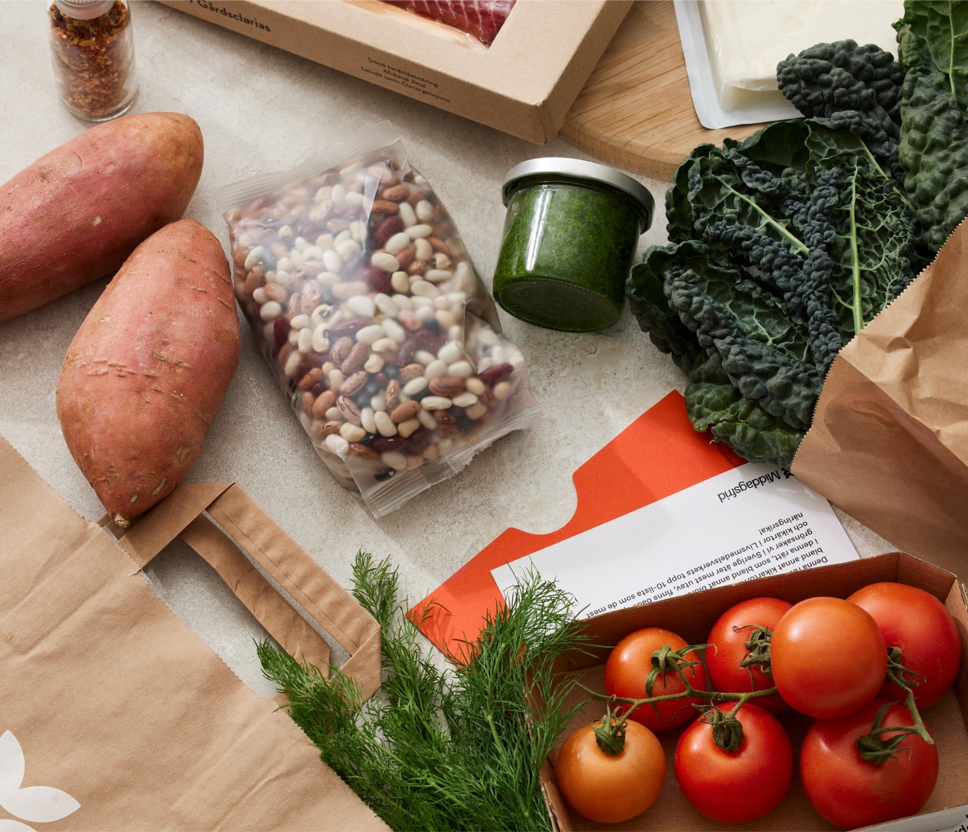 Middagsfrid packaging detail, left of a paired photograph from the rebrand