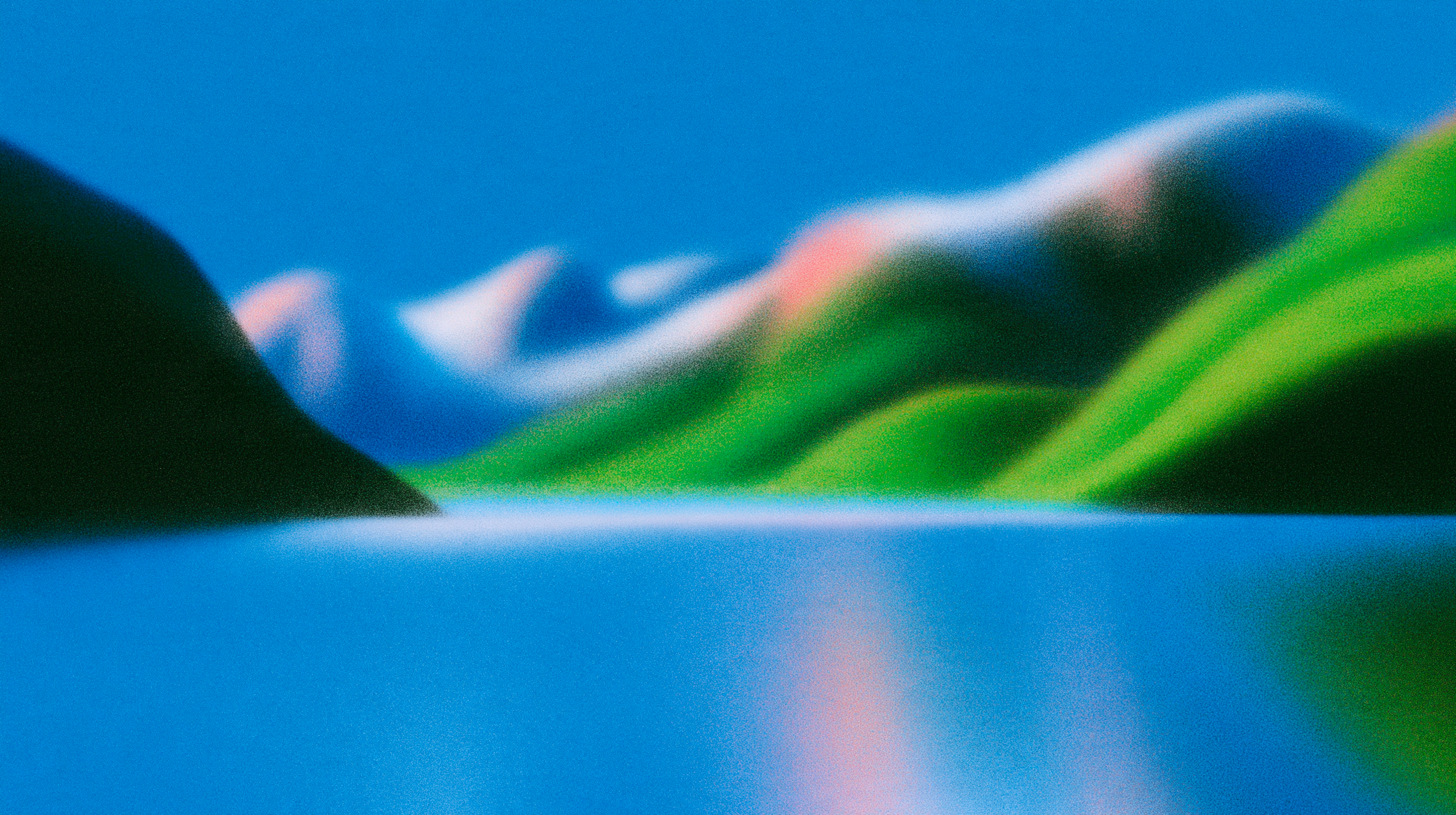 Abstract, grainy landscape of blurred green and pink mountains, a blue lake, and a blue sky.