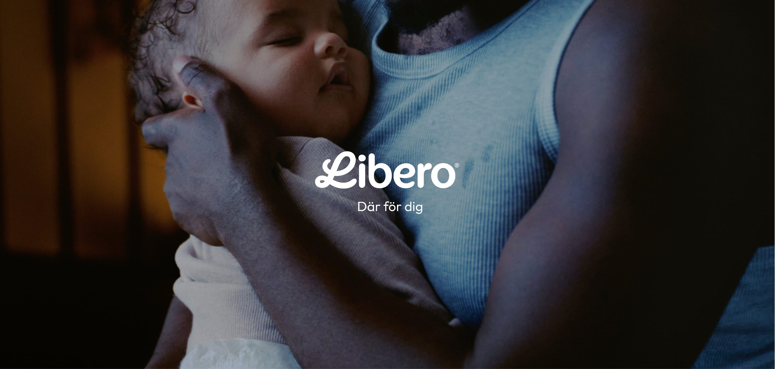 A person holds a sleeping baby, with the Libero logo and "Där för dig" text overlaid.
