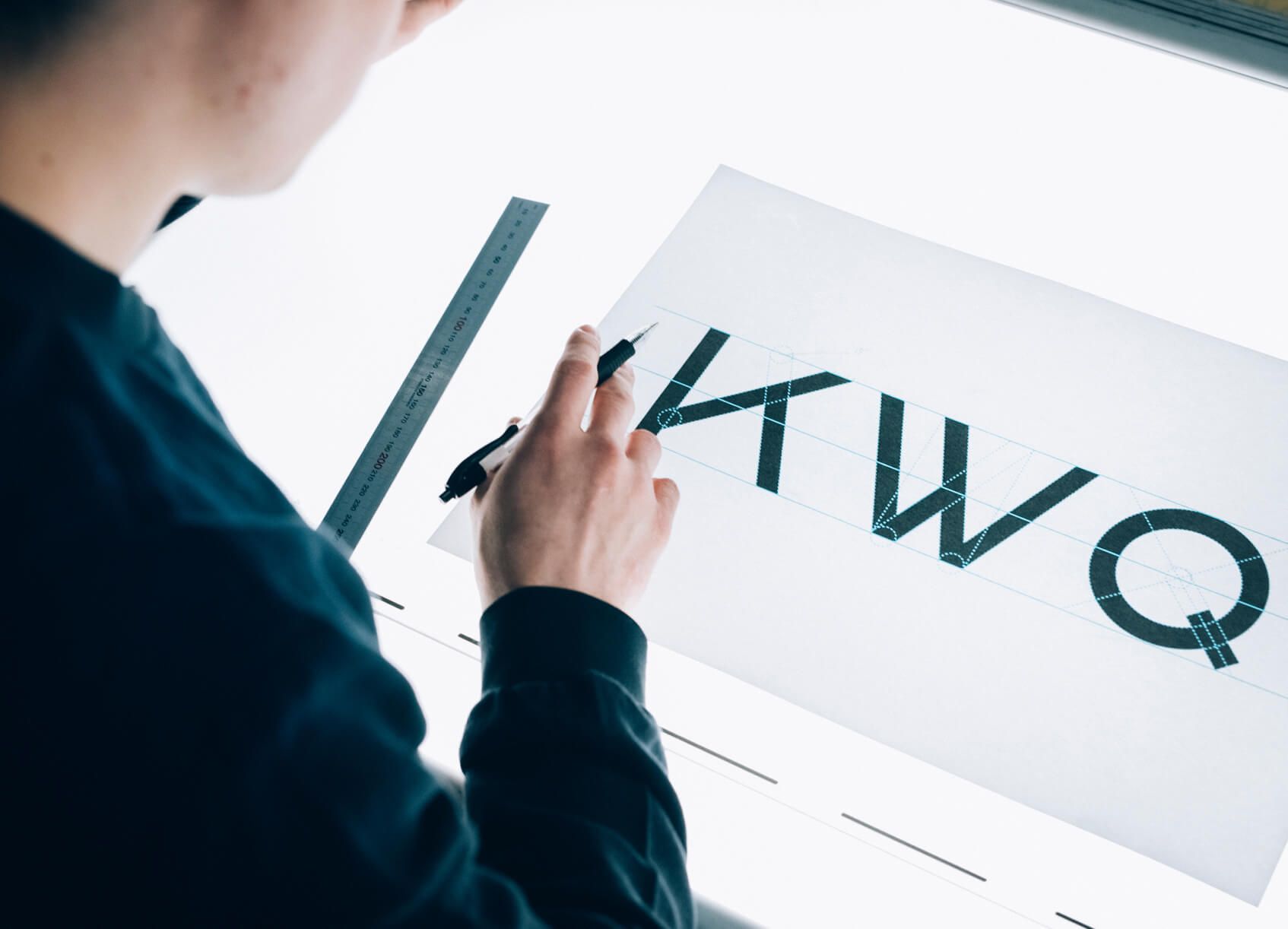 A close detail of Bauhaus type characters set as a specimen, showing the revived typeface's letterforms.
