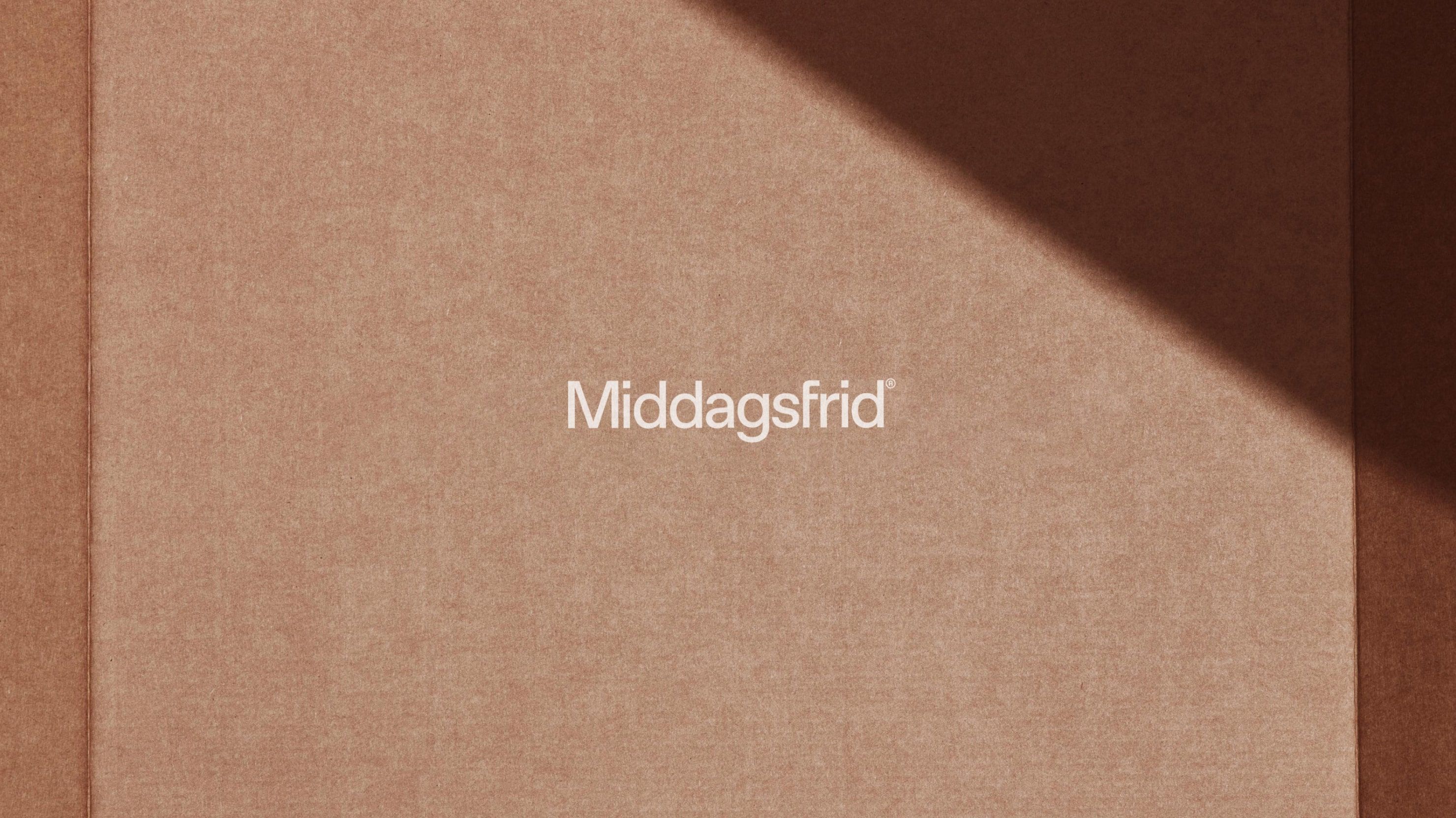 Middagsfrid rebranded dinner-kit bag, full-bleed photograph from the identity rebrand