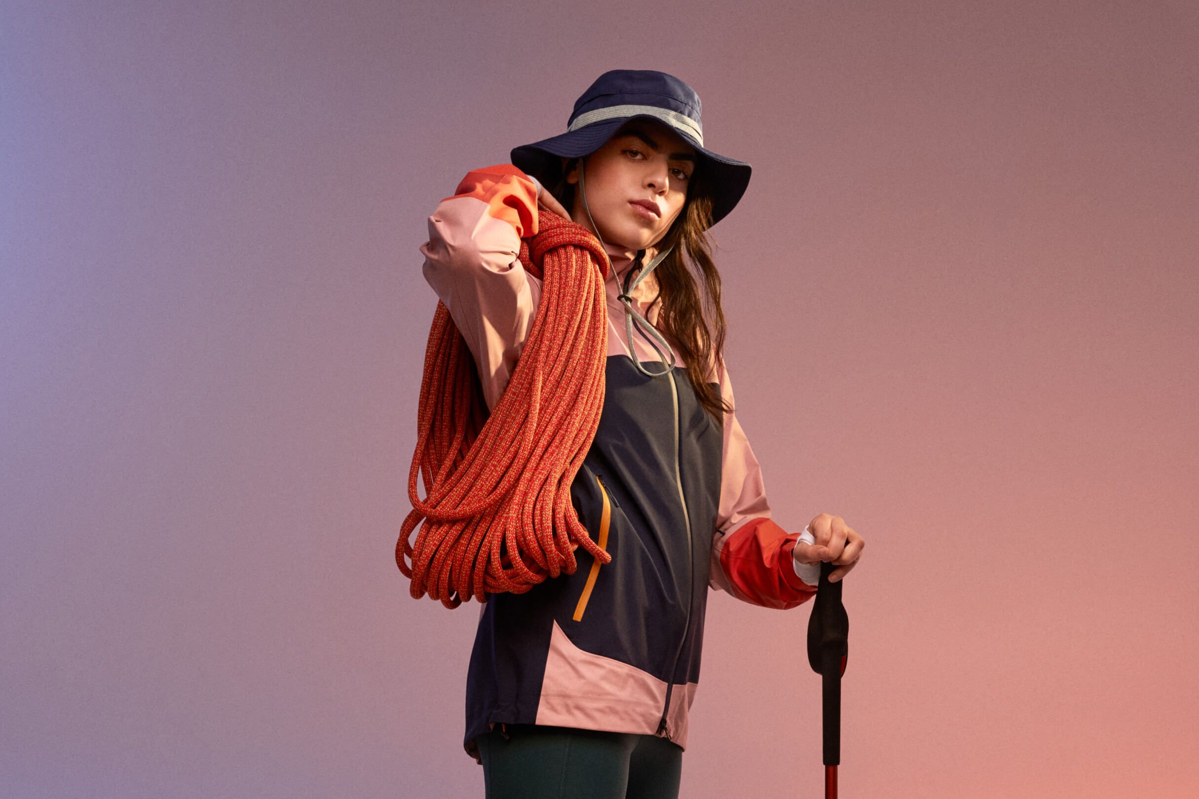 Trailblazer Edition campaign hero: outdoor portrait from Peak Performance's women's capsule collection, shot against rock and wild terrain.