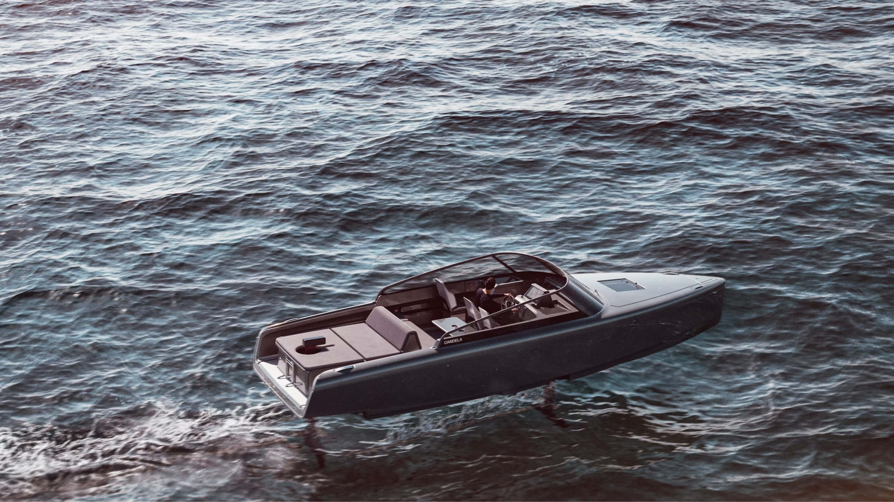 Candela boat and brand identity, the identity system carried across a wide surface