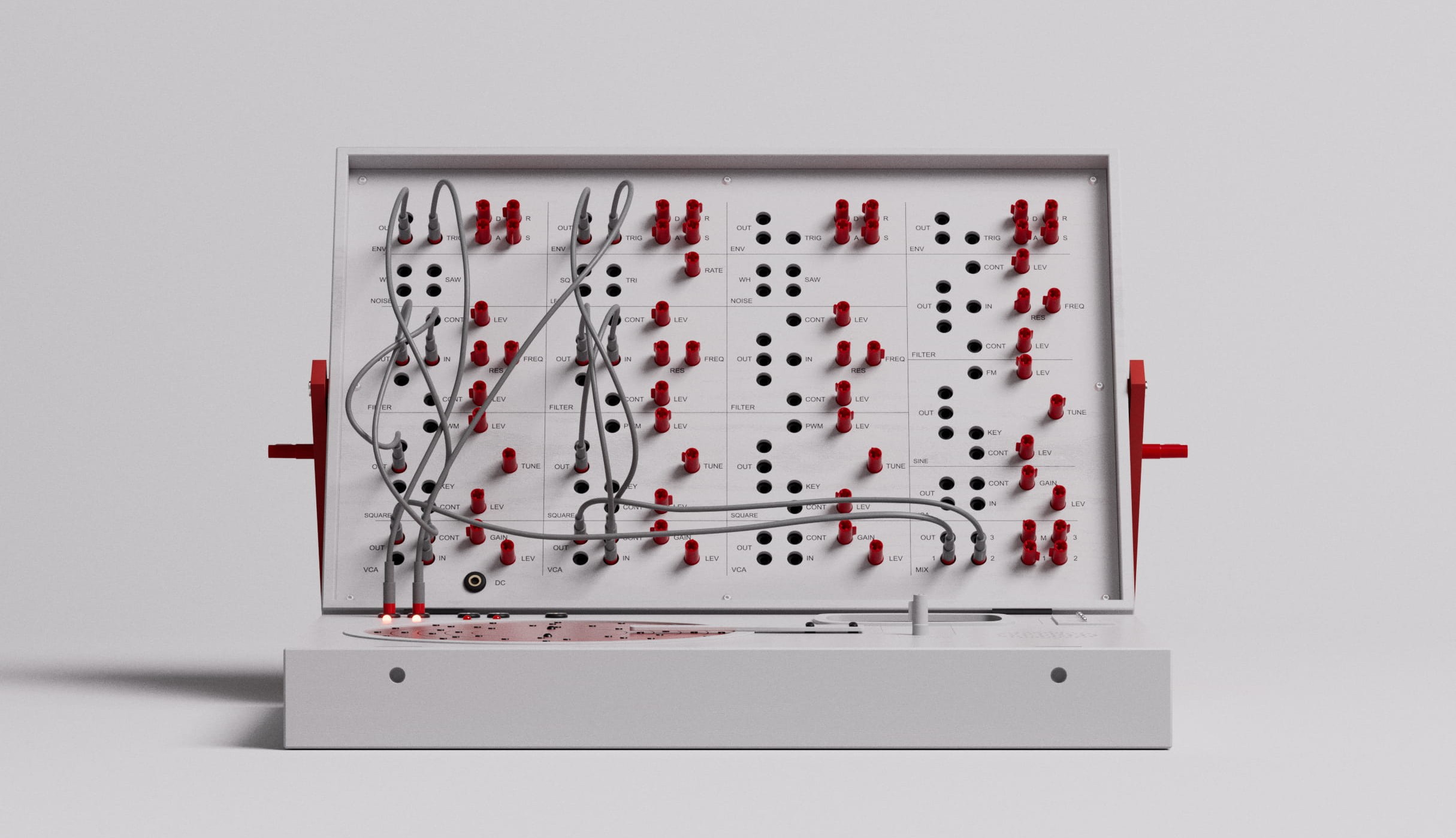 White modular synthesizer with red jacks and grey patch cables.