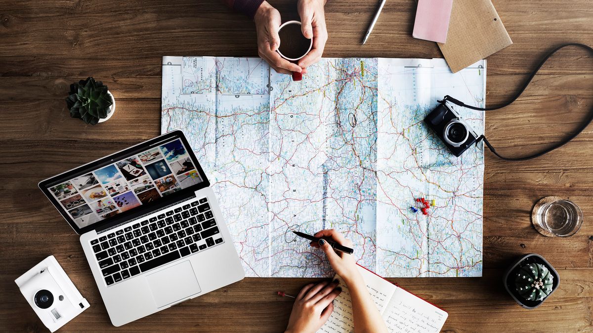 Building a Long-Term Aspen Real Estate Strategy with Stacey K. Kelly – Planning a trip over coffee (Unsplash)