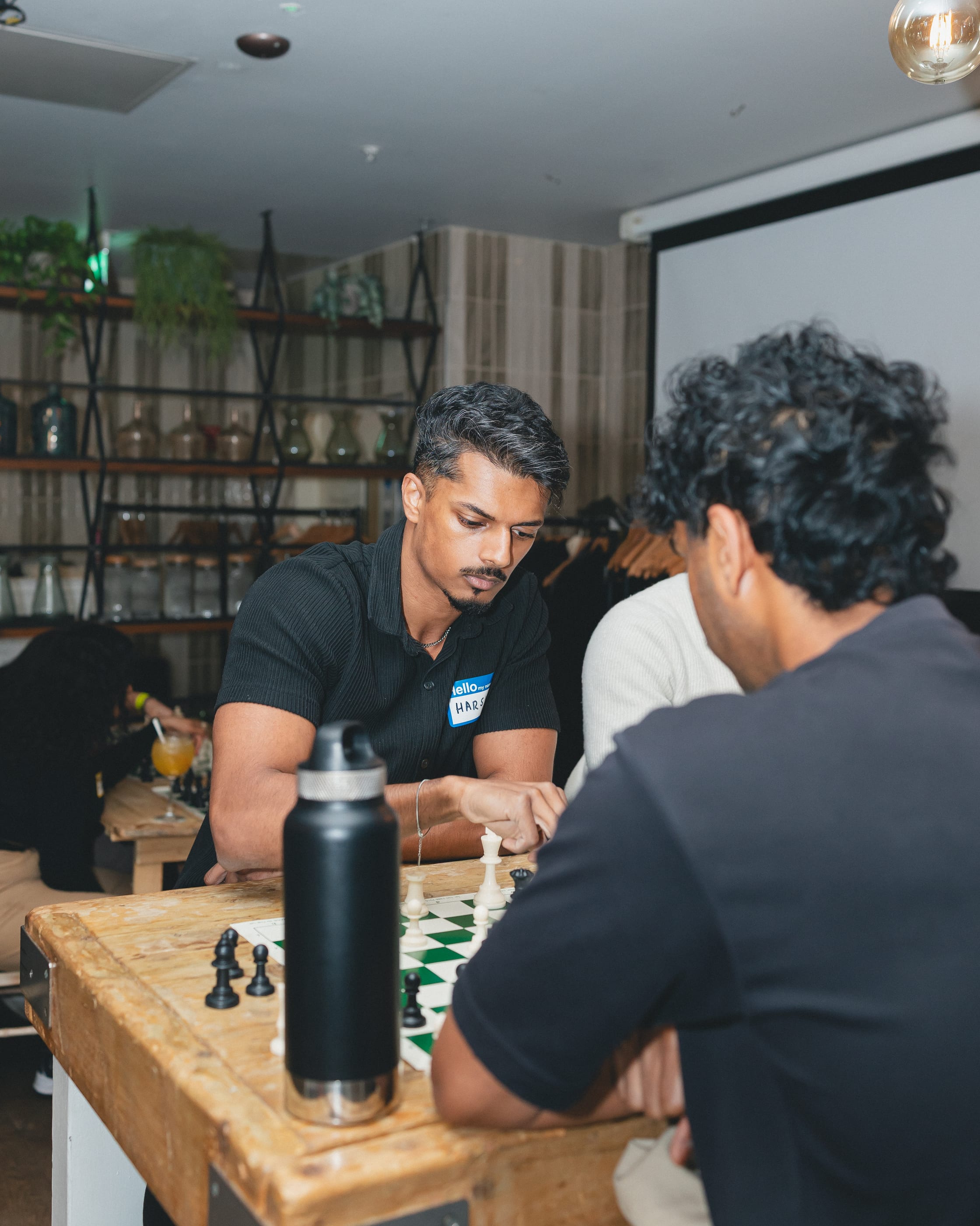 Two players deep in concentration over a game