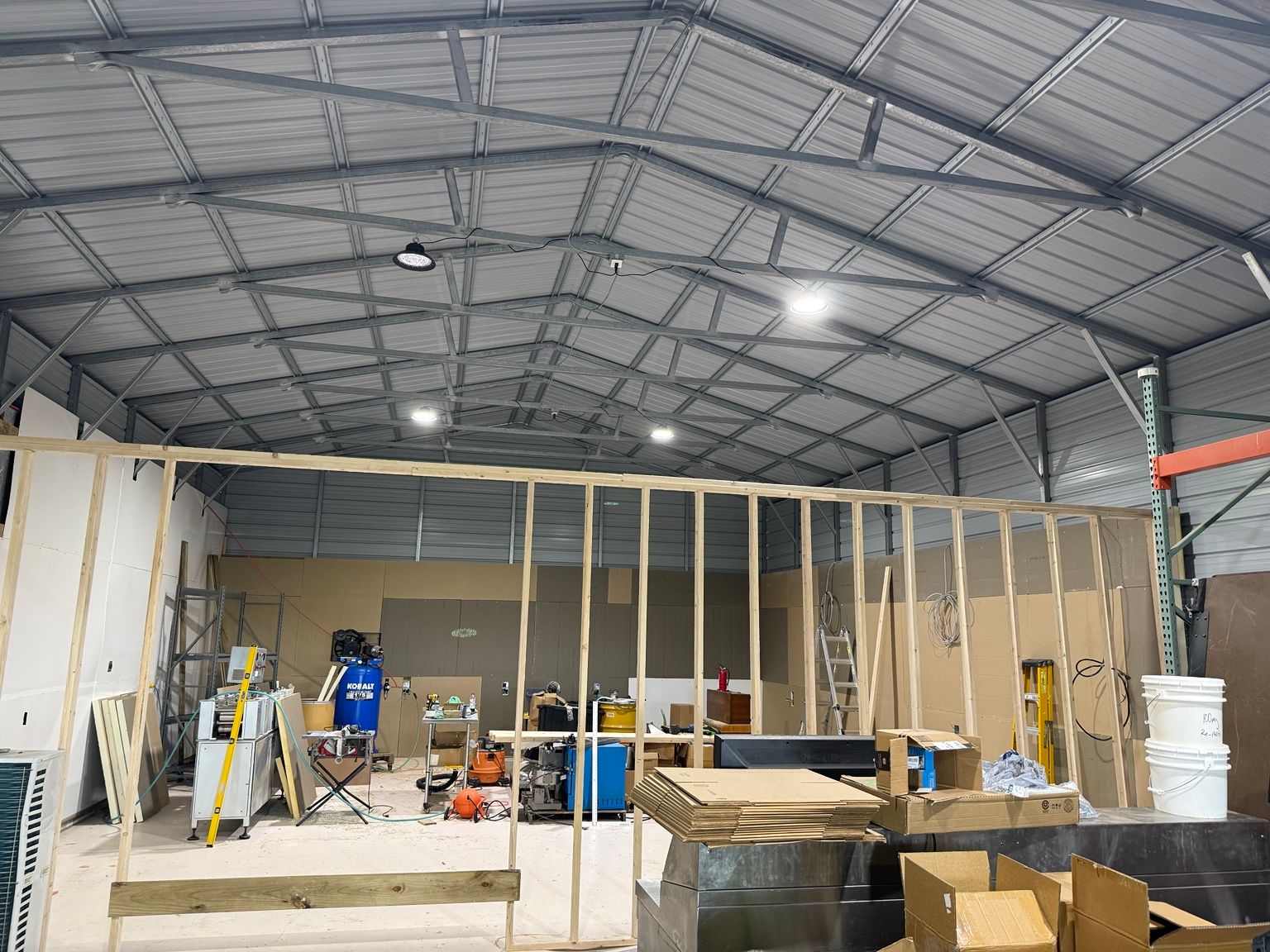 The GSX facility during its initial build-out in Chelsea, Oklahoma, showing exposed steel roof trusses and interior framing