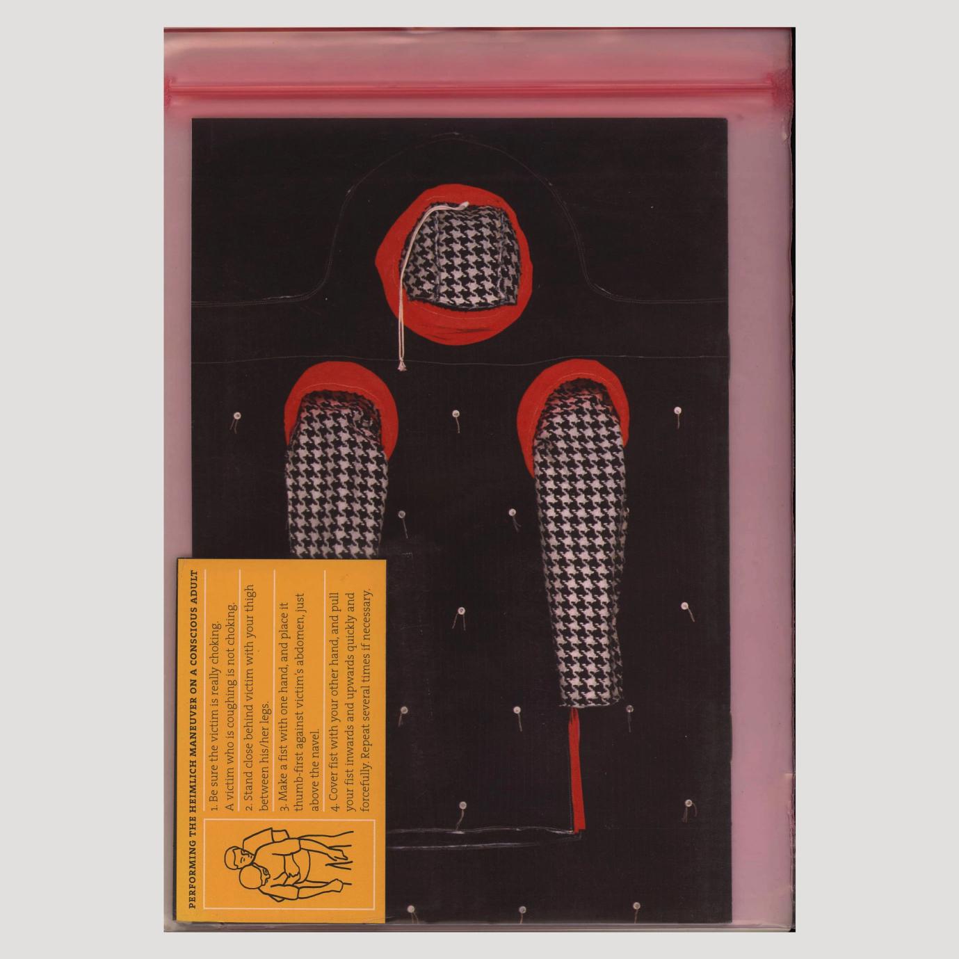 This is an image of the back of a book concealed in a pink, transparent zip-loc plastic bag. On the back cover is a photo of an artwork. The artwork is a wearable sculpture, has a hood and two long sleeves, all made of houndstooth patterned fabric. Where the hood and sleeves connect to the body, there is a thick red fabric acting as a border between the hood, the sleeves, and the body. The body of the sculpture is a rectangular shape, is black, and has small white buttons with two thin threads emerging from the buttons. The buttons are scattered spaciously on the body of the wearable. Included in the zip-loc bag on top of the book is a rectangular yellow magnet describing how to perform the heimlich maneuver on a conscious adult. There is a line drawing illustration of a person giving the heimlich maneuver to another person.