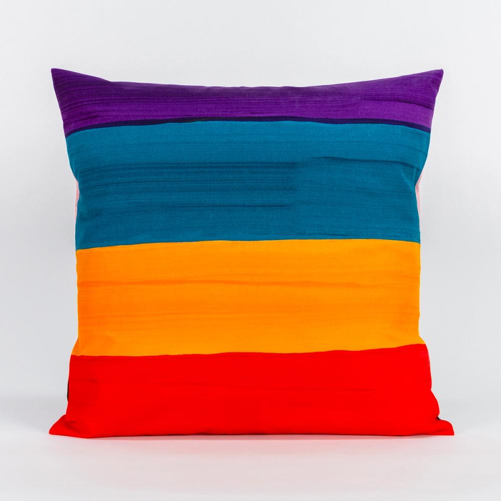 A square pillow featuring painted horizontal stripes of, purple, teal, ochre, and red.