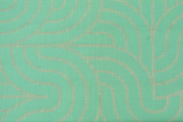 An image of a flat woven teal fabric. Screenprinted on the fabric is a slightly more vibrant pattern of thick teal lines creating abstract shapes.