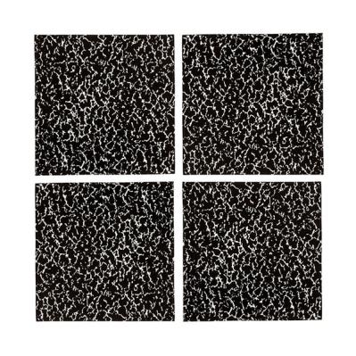 A set of four napkins arrange in quadrants against a white background. All of them features a black and white speckled pattern with more parts black than white so that the white details are thinned in comparison to the merging black blobs.