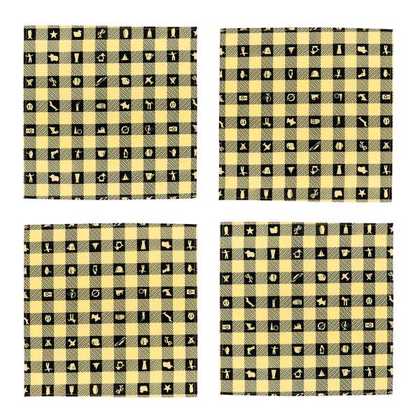 A set of four square napkins featuring a yellow and black checkerboard-style pattern with silhouettes of figures and objects in the recurring black squares.