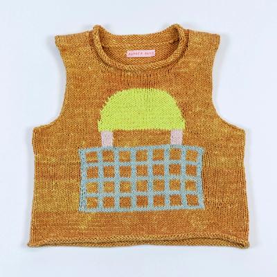 An image of a sleeveless knit sweater laid flat against a white backdrop. The sweater is a variegated orange and light orange. On the front, there is a large light blue grid. There are two light pink accents—above them rests a light yellow semi-circle that resembles a sun setting on the horizon. Inside the back of the neckline, you can see a light pink label with "Andrea Arts" written in red text.