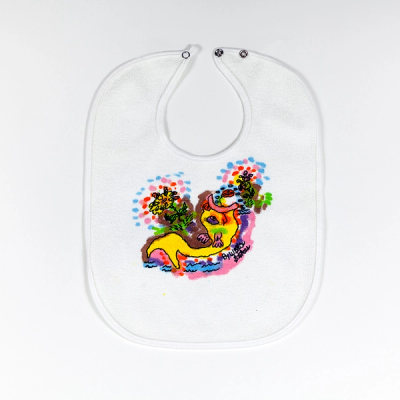 A white baby bib with a drawn and hand-painted image of a yellow fish opening its mouth upward. It is surrounded by colorful waves and flowers with spots of colors emanating outward from the blooms. 