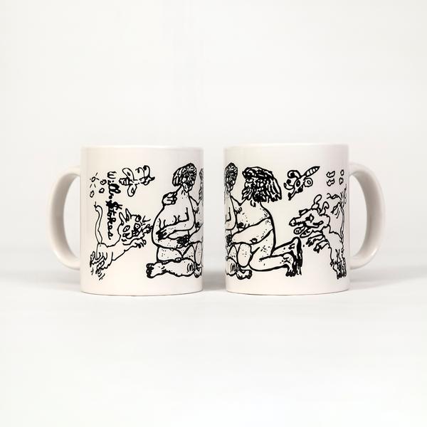 A photograph of two white mugs with their handles facing outward. Drawings made of thin black lines feature an embracing naked couple with whimsical creatures, possibly and cat, dog, and butterflies, surrounding them.