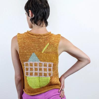 An image of the back of a person with short dark hair wearing a sleeveless knit sweater. Her right arm is folded with her hand resting on her hip. The sweater is a variegated orange and light orange. There is a large light pink grid with a gray triangle above it and a yellow half-circle below it, resembling a setting sun. Above, a yellow bar streaks diagonally toward the triange.