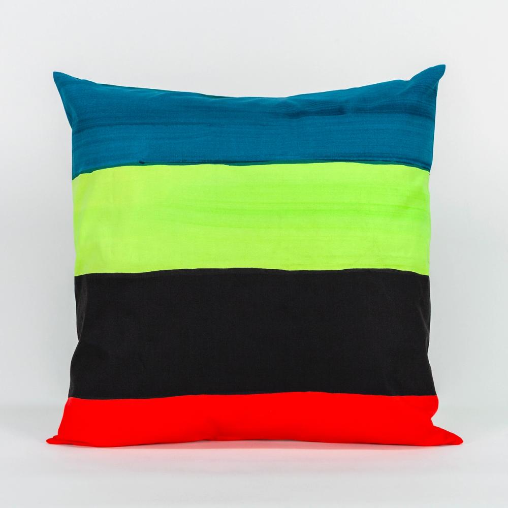 A square pillow featuring painted horizontal stripes of teal, chartreuse, black, and red.