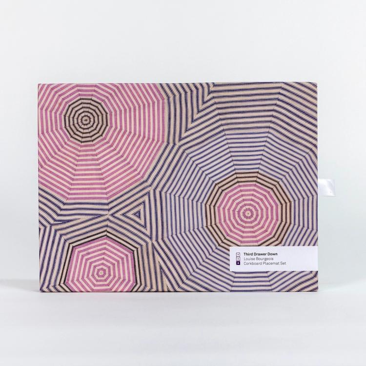 A box featuring a design of striped fabric cut into triangles and arranged to create a 12-sided circle-like shape.
