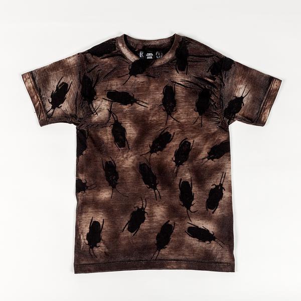 A mottled brown t-shirt with large black roaches printed across it.