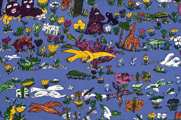 An image of a fabric with a faded dark blue background and features loose, gestural illustrations of colorful plants and animals. The illustration is drawn with a crayon-like texture.