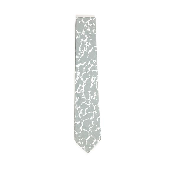 A folded tie featuring a speckled gray and white design. The tie is mostly gray as the irregular gray blob-like shapes leave spare room for the white edges. 