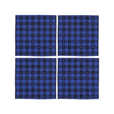 A set of four square napkins featuring a blue and black checkerboard-style pattern with silhouettes of figures and objects in the recurring black squares.