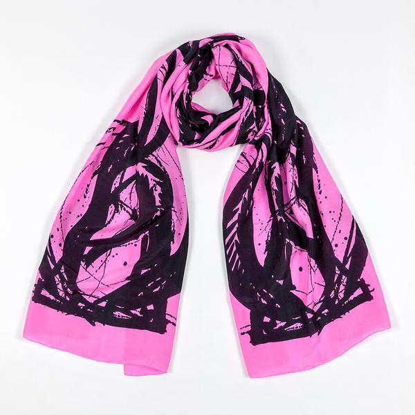 A silk scarf tied in a loose knot and laid against a white ground. This one is pink and features bold, painterly gestures with ink drips and splatters that follow the curving motion of a brush.