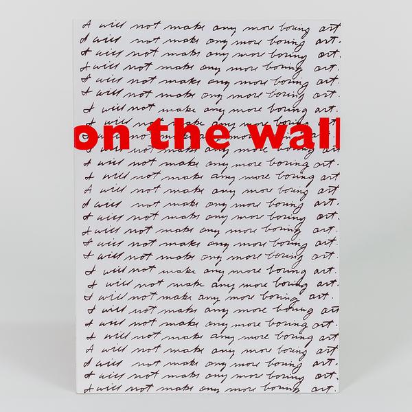 A paperback book cover. The title of the book is in a red sans-serif font reading "on the wall" and in the back ground in a handwritten script font reads "I will not make any more boring art." repeatedly all down the cover of the book.