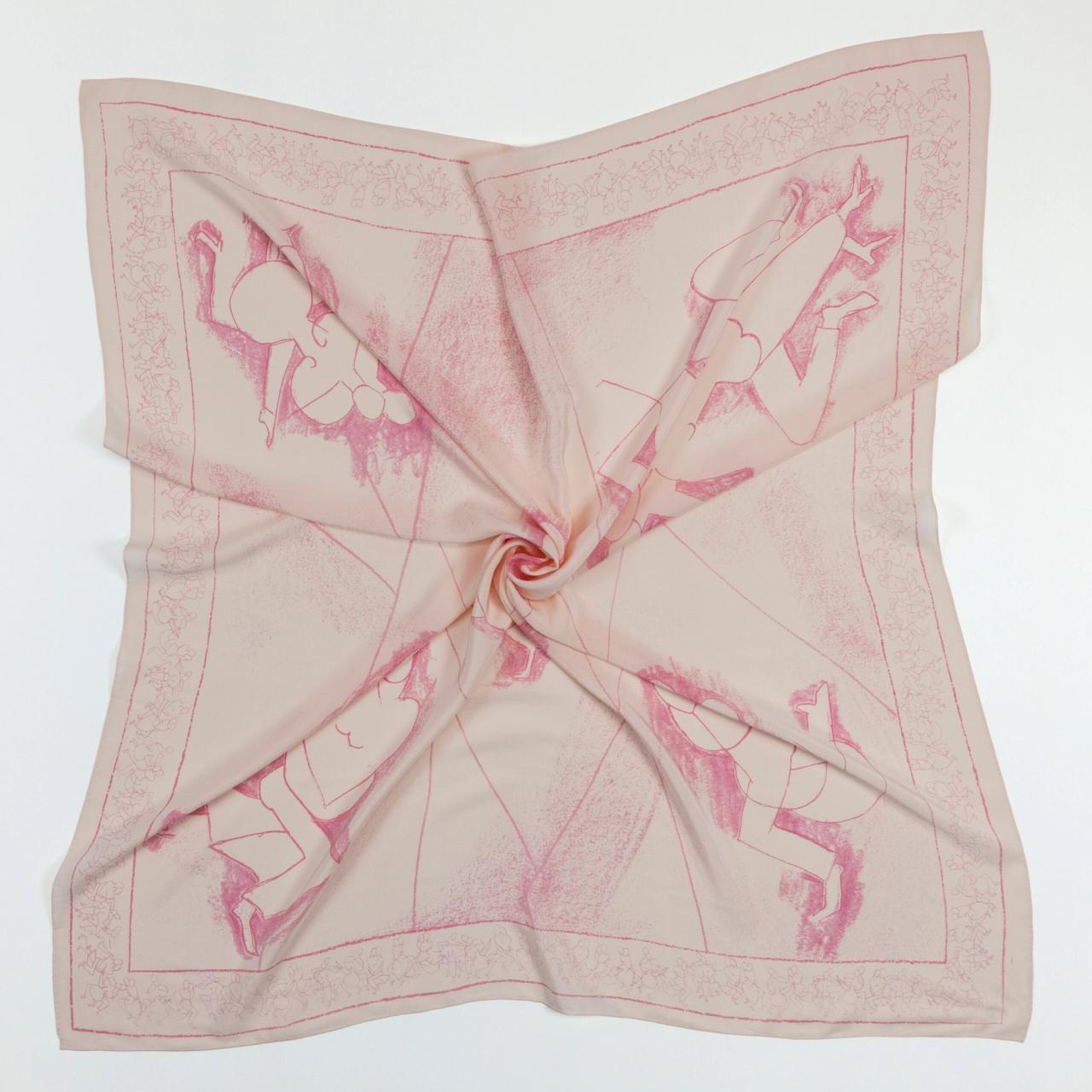 An image of a light pink scarf against a white background, but with the material twisted towards the center to show the light, silky structure of the fabric.
