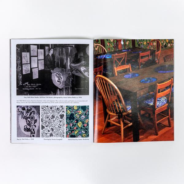 A photograph of an open spread of a book. On the left, there is a black and white portrait photograph of Heterodoxy member Amy Mali Hicks. Below the photograph is a triptych of photographs moving from inspiration, to concept sketch, to final rug tufted artwork. On the right is a full-bleed photograph of a gallery installation view featuring two long wooden tables with inset vitrines surrounded by wooden chairs.