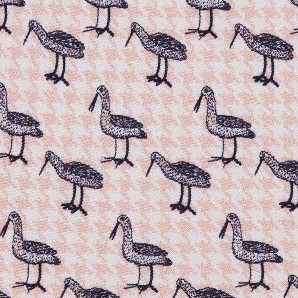 A detail of a pattern of black illustrated Bata birds with long beaks in alternating stances on a light pink and white houndstooth background.