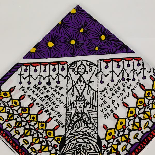 A detail of decorative napkins. This corner shows patterns of starbursts and rows of drawn shapes. At the center is a pillar with stacked faces. The text reads "We want you to come back. Bring Lizabeth with you and others, Anne" and "Don't get down. We care for you a lot so bless you now."