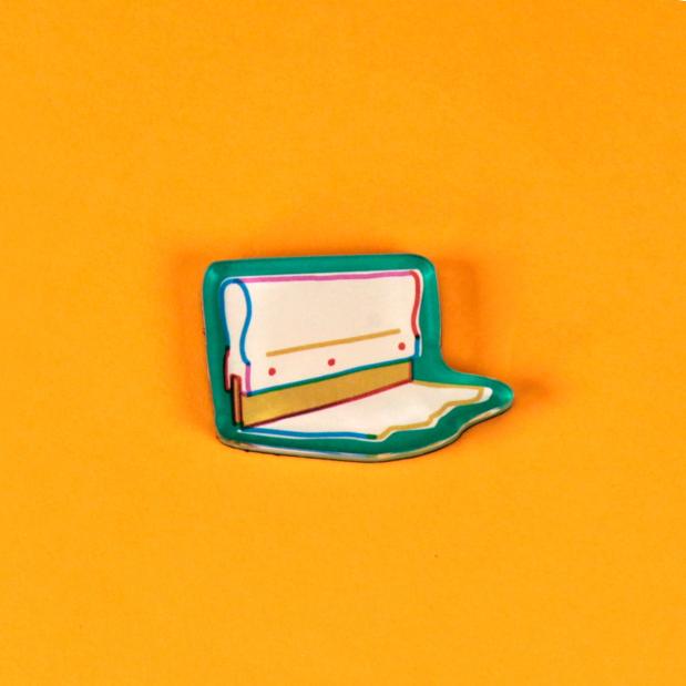 A tool magnet in the form of a green outlined squeegee and ink trail is laid out against a bright, warm yellow background.