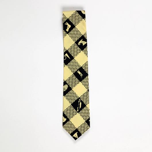A light yellow and black checkerboard-style necktie with silhouettes of figures and objects such as a radio and car in the recurring black squares.