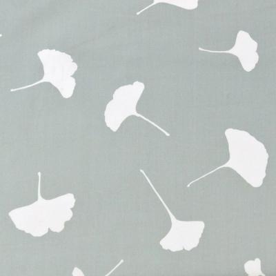 A gray, slightly green background with a seven white silhouettes in the shape of ginkgo leaves (fan-like wedges with long, thin stems). The leaves are uniquely drawn with slight variations including stem length, leaf breadth, and direction.