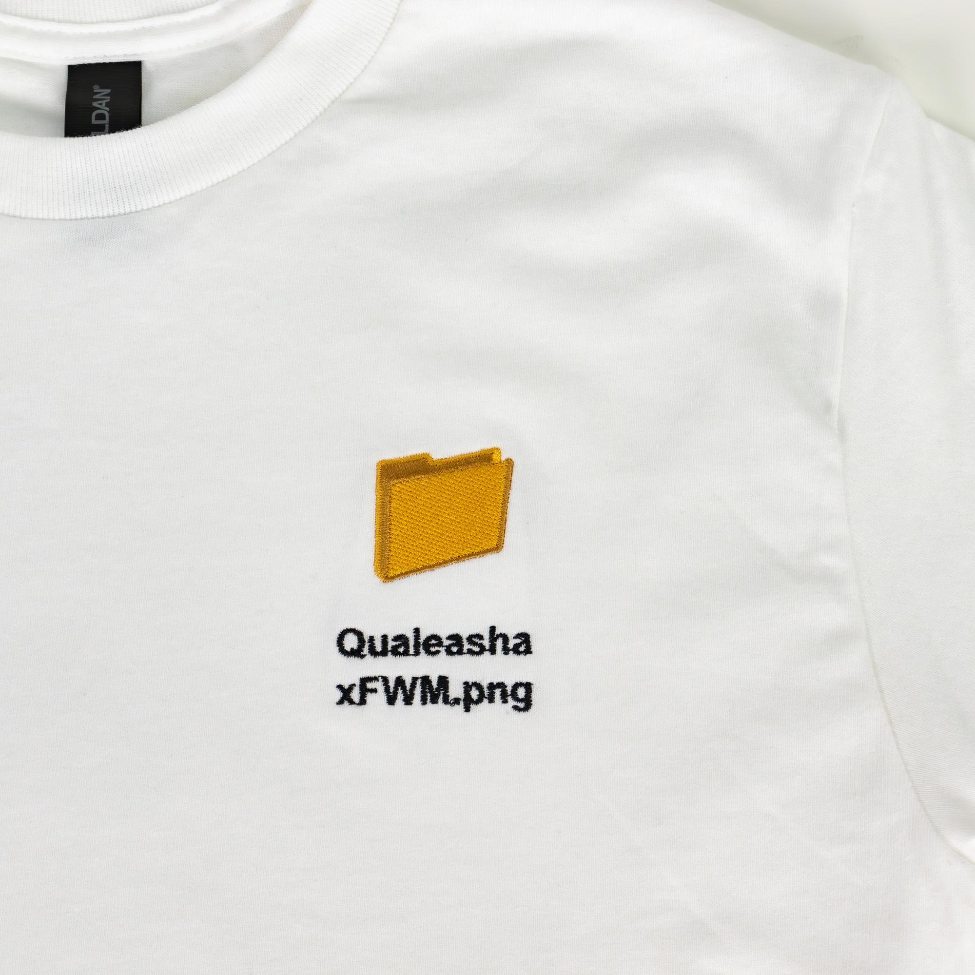 A detail photo of a white t-shirt with a 1.5 inch yellow computer desktop folder embroidered on the upper left side of the shirt. Below the folder reads "Qualeasha x FWM.png" in black embroidery thread.