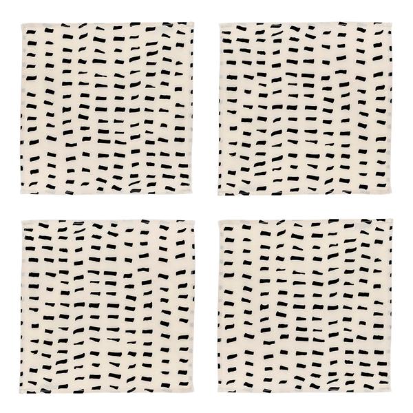 A set of four square napkins composed of cream-colored fabric with several rows of short brushstroke-like black dashes.