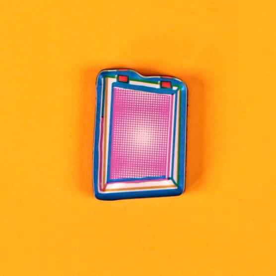 A tool magnet in the form of a colorful and illustrative silkscreen with a pink halftone is laid out against a bright, warm yellow background.