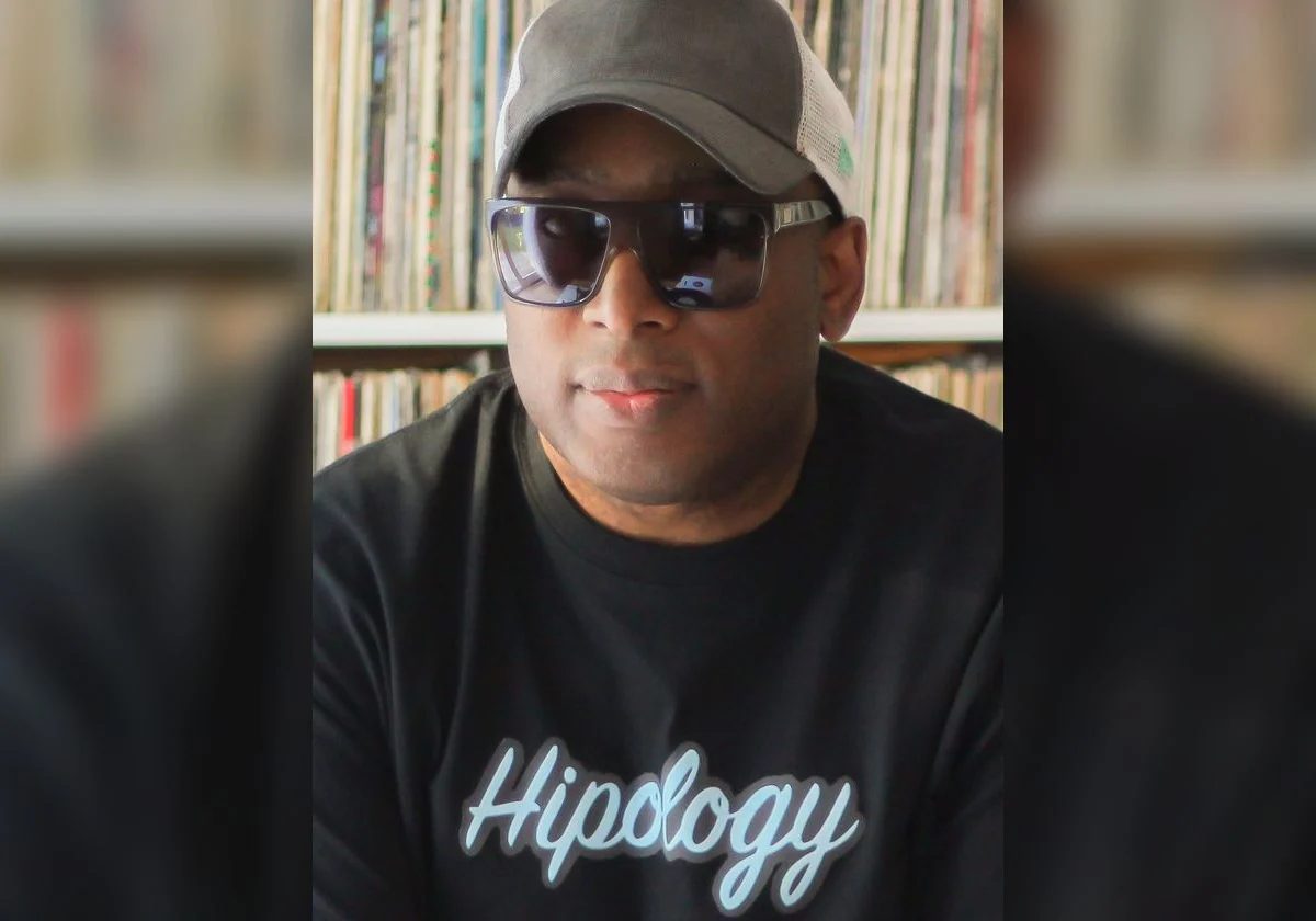 Marc Mac of 4hero and Visioneers photographed in front of a record shelf