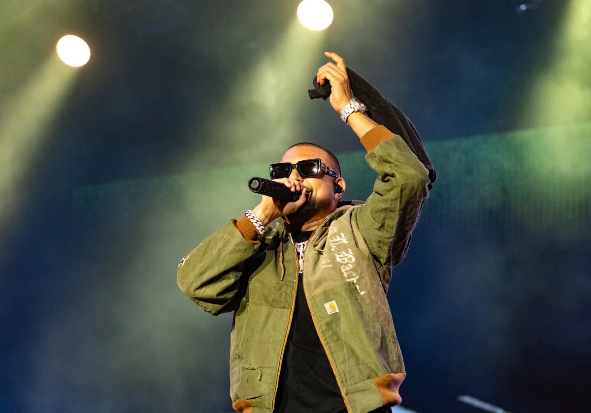 Sean Paul performing live at Venoge Festival in 2025 with a microphone raised to his face