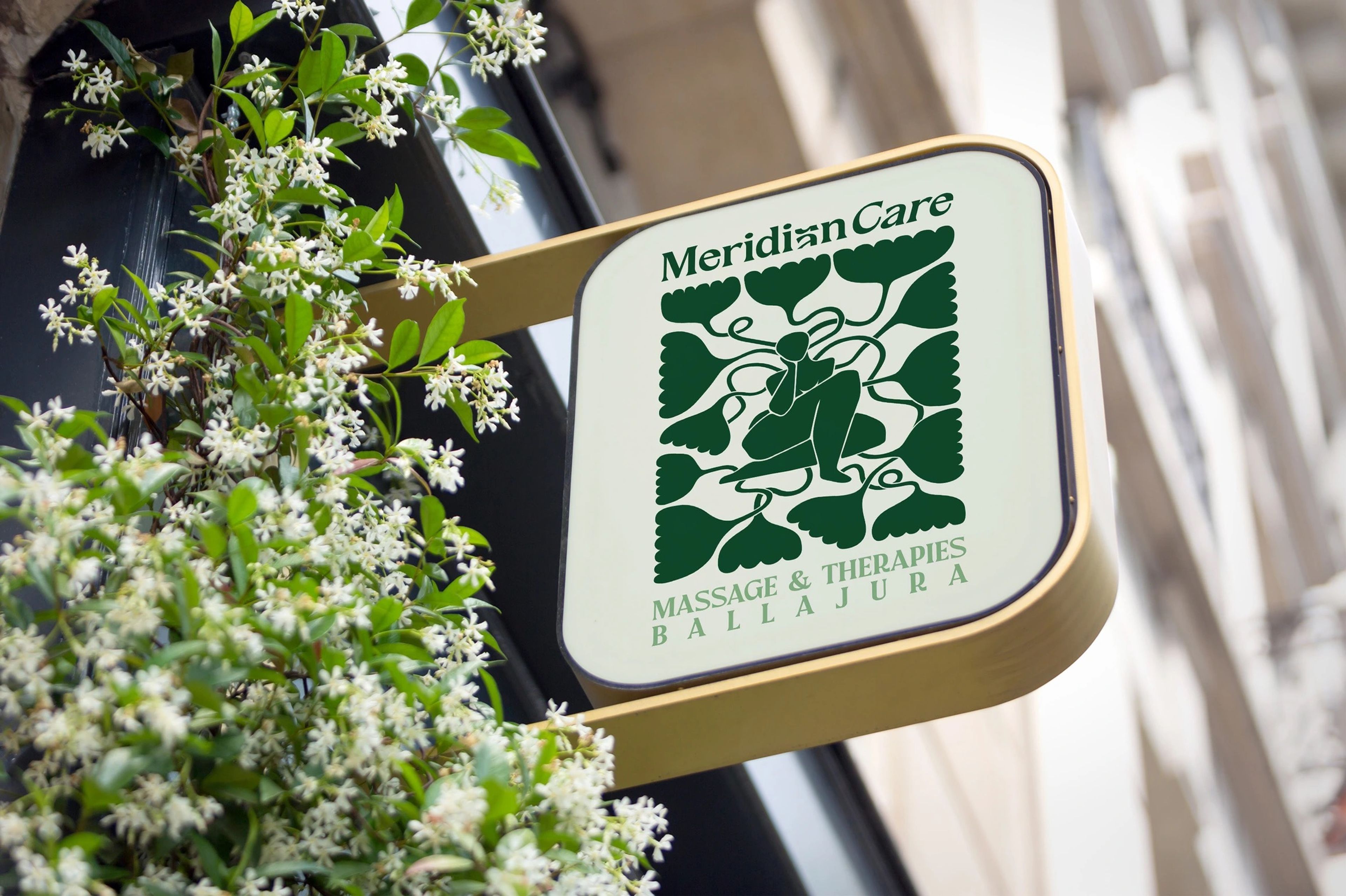 Meridian Care round hanging sign among blossoms