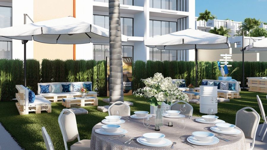 Open-air dining setup with white parasols and a dressed table on a garden terrace — destination wedding design visualisation, BACKSTAGE Event