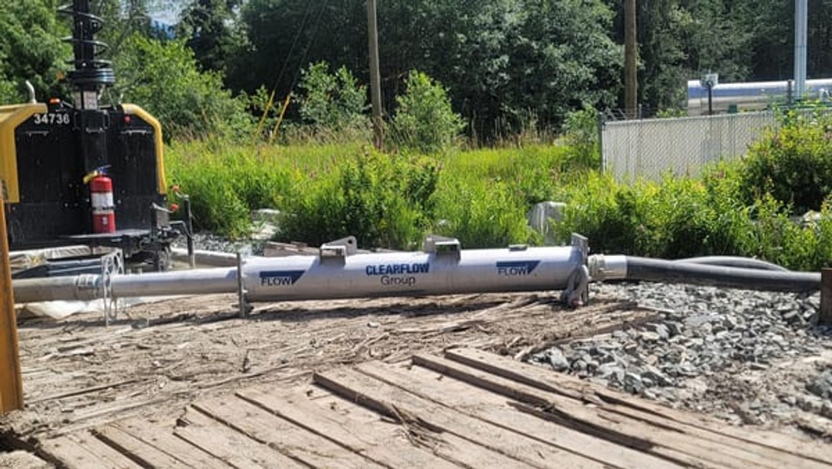 Gel flocculant reactor running on timber mats beside the treated discharge ditch
